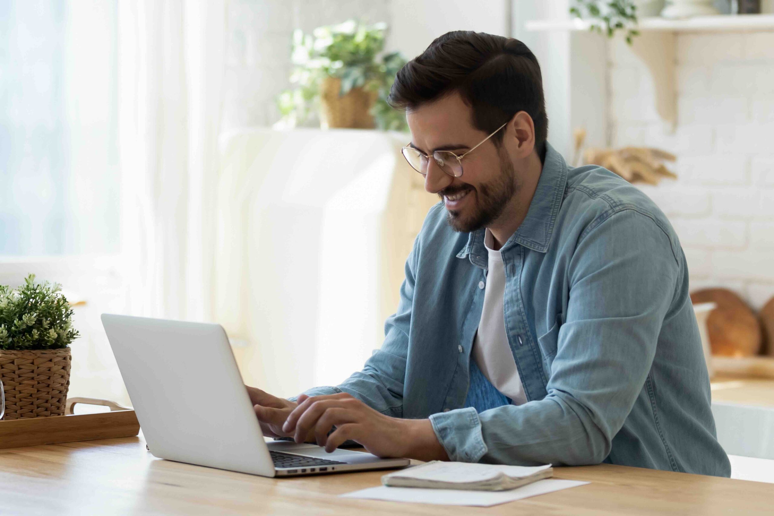 Student using laptop and studying in the Home Office.