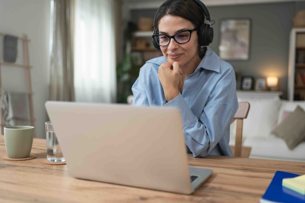 Student using laptop and studying in the Home Office.
